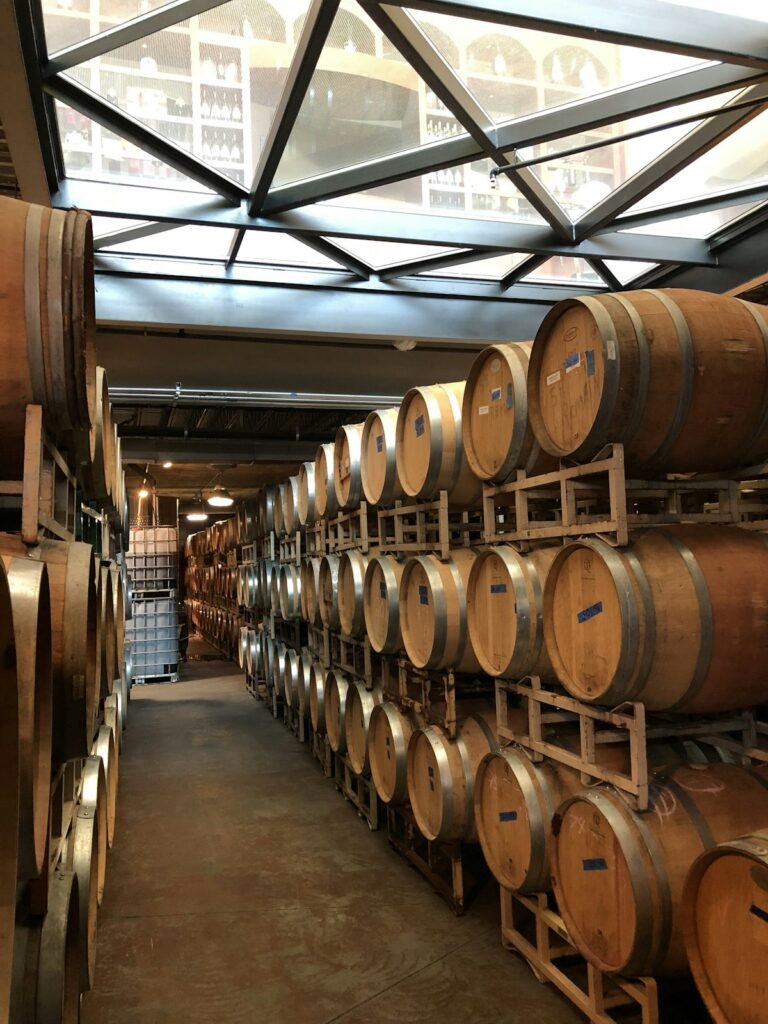 Wooden barrels in a family winery cellar