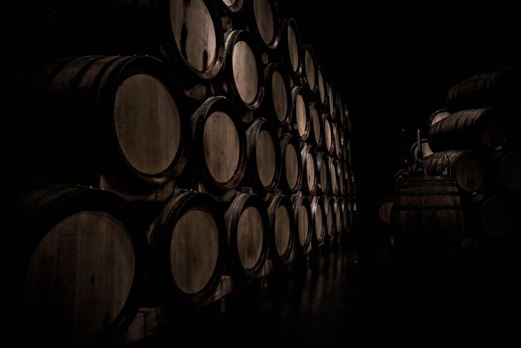 Wine cellar with barrels representing winery legacy
