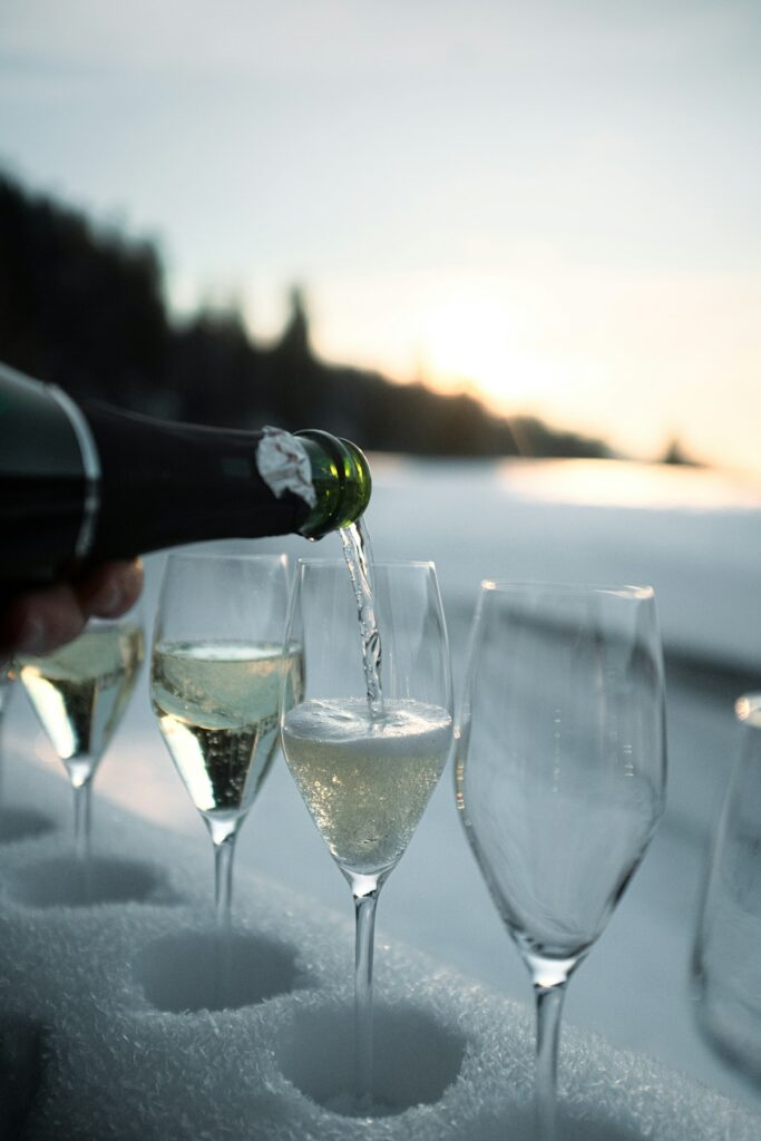 Champagne being poured into glasses celebrating special occasion