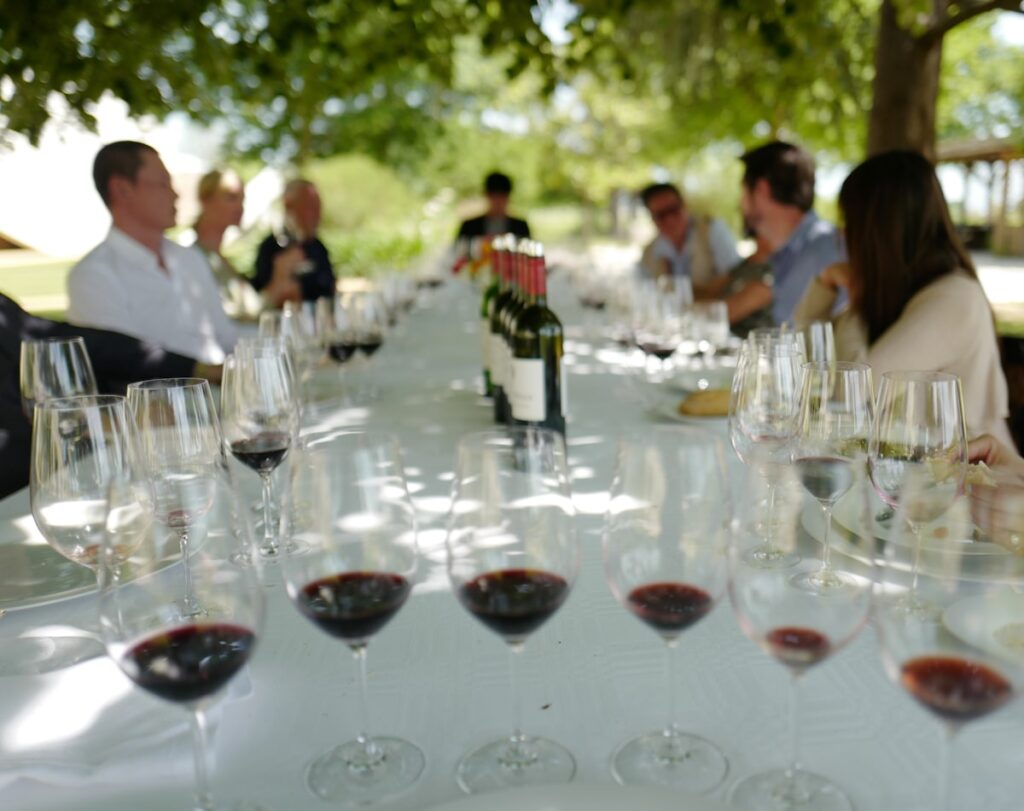 Guests enjoying outdoor wine tasting at a winery event