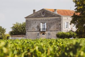Heritage winery stone building representing brand storytelling and commerce