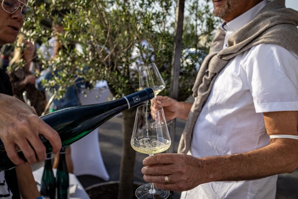 Winery tasting room guests pouring wine heritage visitor experience