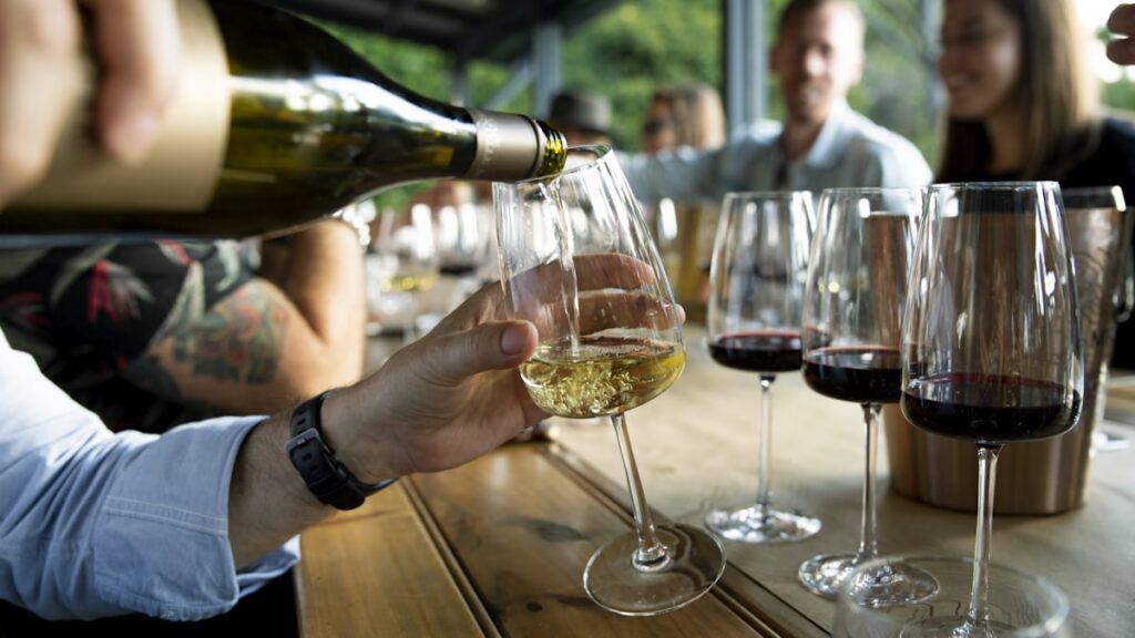 Young adults wine tasting representing modern under-45 buyers