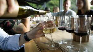 Young adults wine tasting representing modern under-45 buyers